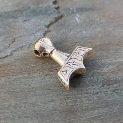 Ferocious Beast Thors Hammer Pendant -The Viking Dragon Shop ad ferocious beast thors hammer on rock bronze back angle view