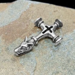 Large Icelandic Wolf Cross Hammer Replica Pendant -The Viking Dragon Shop ad large silver icelandic wolf hammer on rock side view