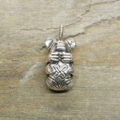 Gripping Bear Pendant -The Viking Dragon Shop ad silver gripping bear pendant on rock back