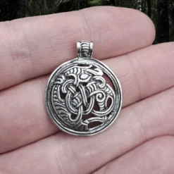 Round Dragon Beast Pendant -The Viking Dragon Shop ad silver round gripping beast dragon pendant on hand