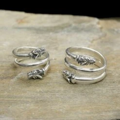 Silver Spiral Wolf Ring -The Viking Dragon Shop ad silver spiral wolf rings on rock