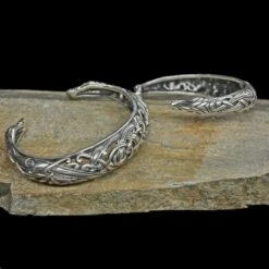 Silver Urnes Dragon Bracelet -The Viking Dragon Shop ad silver urnes arm rings on rock