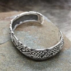 Silver Viking Raven Arm Ring -The Viking Dragon Shop ad silver viking raven bracelet arm ring on rock above