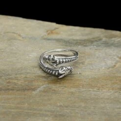 Silver Ridged Viking Wolf Ring -The Viking Dragon Shop ad silver viking ridged double wolf ring on rock