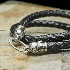 Braided Leather Necklace With Silver Ferocious Wolf Heads -The Viking Dragon Shop bt 8mm width braided leather necklace silver ferocious wolf heads on rock