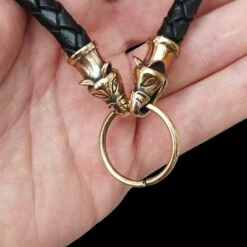 Braided Leather Necklace With Bronze Icelandic Wolf Heads -The Viking Dragon Shop bt bronze 8mm braided leather necklace icelandic wolf heads split ring in hand