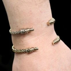Twisted Bronze Bracelet With Gotlandic Dragon Heads -The Viking Dragon Shop bt bronze twisted bracelets gotland dragon heads on wrist