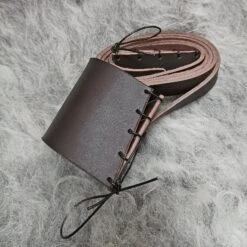 Handmade Leather Shoulder Strap For Viking Drinking / Blowing Horn -The Viking Dragon Shop bt brown leather shoulder strap on wool rolled up
