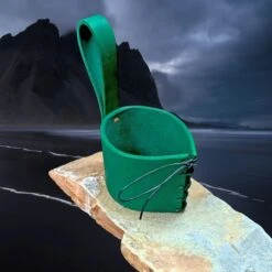 Viking Drinking Horn Leather Belt Hanger -The Viking Dragon Shop bt green leather horn hanger on rock