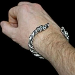 Thick Twisted Silver Arm Ring With Gotlandic Dragon Heads -The Viking Dragon Shop bt large silver twisted gotland armring on wrist 382066