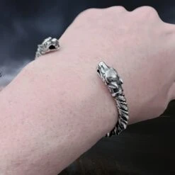 Twisted Silver Viking Bracelet / Arm Ring With Ferocious Wolf Heads -The Viking Dragon Shop bt silver twisted arm ring ferocious wolf heads on wrist