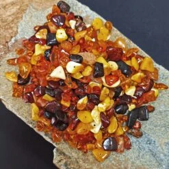 Polished Amber Chips With Drilled Holes -The Viking Dragon Shop eg polished amber beads on rock x 50g