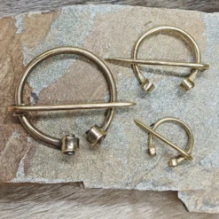 Brass Clothes Pin / Cloak Pin / Fibula -The Viking Dragon Shop mw brass cloak pins on rock