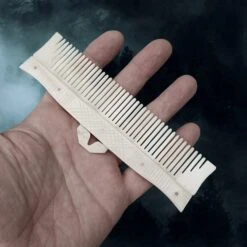 Long Decorated Bone Viking Comb With Hanger -The Viking Dragon Shop nc long bone comb with rivets on hand