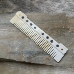 Medium Decorated Bone Viking Comb -The Viking Dragon Shop pm medium bone comb on rock