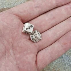Small Bone Viking Dice With Dot And Ring Marks -The Viking Dragon Shop pm small bone dice black dot and ring marks in hand x2