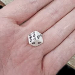 Small Bone Viking Dice With Dot And Ring Marks -The Viking Dragon Shop pm small bone die black dot and ring marks in hand
