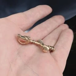 Bronze Wolf Cross Thors Hammer Pendant -The Viking Dragon Shop pp bronze small icelandic wolf hammer on hand side angle view