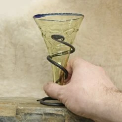 Blue Rim Decorated Glass Viking Cone Beaker With Iron Stand -The Viking Dragon Shop sg decorated viking cone beaker with blue rim on rock with hand