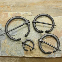 Plain Iron Penannular Brooch / Cloak Pin 11 Plain Iron Penannular Brooch / Cloak Pin -The Viking Dragon Shop sg iron cloak pins on rock