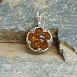 Silver Gotland Filigree Amber Ball Pendant -The Viking Dragon Shop sn amber ball pendant on rock