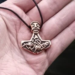 Bronze God Beast Thors Hammer Pendant -The Viking Dragon Shop sn bronze godbeast thors hammer replica from norway on leather thong on hand
