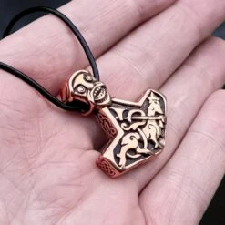 Bronze God Beast Thors Hammer Pendant -The Viking Dragon Shop sn bronze godbeast thors hammer replica from norway on leather thong on hand angle view