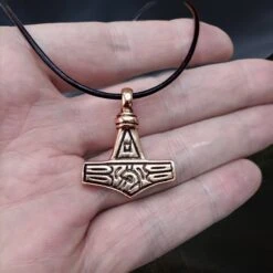 Bronze Gotland Replica Thors Hammer Pendant -The Viking Dragon Shop sn bronze gotland thors hammer on hand on thong back