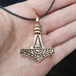 Large Bronze Gotland Replica Thors Hammer Pendant -The Viking Dragon Shop sn bronze large gotland hammer front on hand on leather thong