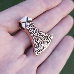 Bronze Mammen Axe Head Pendant -The Viking Dragon Shop sn bronze mammen axe head pendant on hand angle view