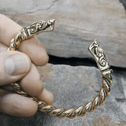 Twisted Bronze And Silver Bracelet With Gotlandic Dragon Heads -The Viking Dragon Shop sn bronze silver twisted bracelet gotland dragon heads in fingers
