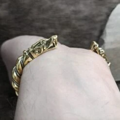 Twisted Bronze And Silver Bracelet With Gotlandic Dragon Heads -The Viking Dragon Shop sn bronze silver twisted bracelet gotland dragon heads on back wrist