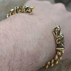 Twisted Bronze And Silver Bracelet With Gotlandic Dragon Heads -The Viking Dragon Shop sn bronze silver twisted bracelet gotland dragon heads on wrist