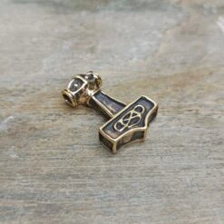 Small Bronze Thunder Thors Hammer Pendant -The Viking Dragon Shop sn bronze small thunder thors hammer on rock front angle view