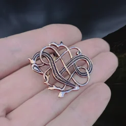 Bronze Jelling Dragon Viking Brooch 6 Bronze Jelling Dragon Viking Brooch -The Viking Dragon Shop sn bronze urnes dragon brooch on hand angle view