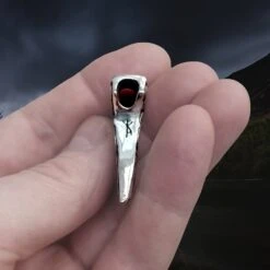 Silver Knotwork Viking Axe Head Pendant -The Viking Dragon Shop sn silver knotwork axe head pendant in hand underside view