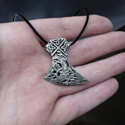 Silver Knotwork Viking Axe Head Pendant -The Viking Dragon Shop sn silver knotwork axehead pendant on leather thong on hand