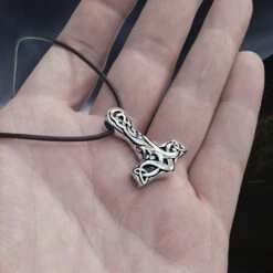 Medium Silver Interlace Thors Hammer Pendant -The Viking Dragon Shop sn silver medium interlace thors hammer pendant on leather thong on hand angle view