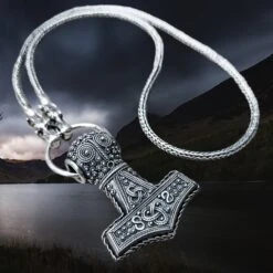Slim Silver Snake Chain Necklace With Tromso Dragon Heads -The Viking Dragon Shop sn silver oland thors hammer on split ring with tromso dragon head snake chain angle view