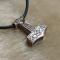 Bronze Odeshög Thors Hammer Pendant -The Viking Dragon Shop wl bronze oseberg thors hammer on fur side view