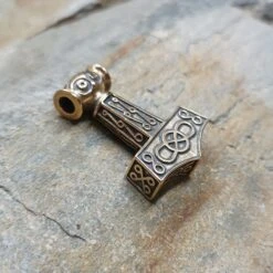 Bronze Odeshög Thors Hammer Pendant -The Viking Dragon Shop wl bronze oseberg thors hammer on rock side view