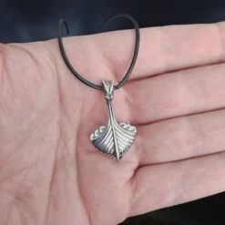 Silver Oseberg Viking Ship Pendant -The Viking Dragon Shop wl silver oseberg viking ship pendant on leather cord on hand