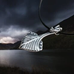 Silver Oseberg Viking Ship Pendant -The Viking Dragon Shop wl silver oseberg viking ship pendant on leather cord side angle view